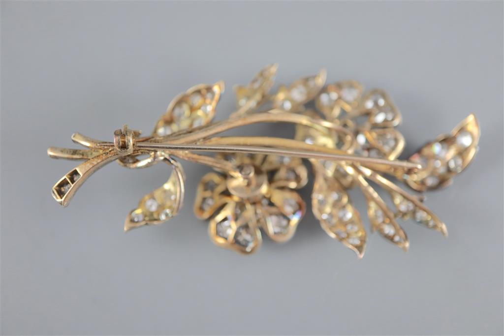 A Victorian gold, silver and graduated old round and cushion cut diamond set trembleuse floral spray brooch,